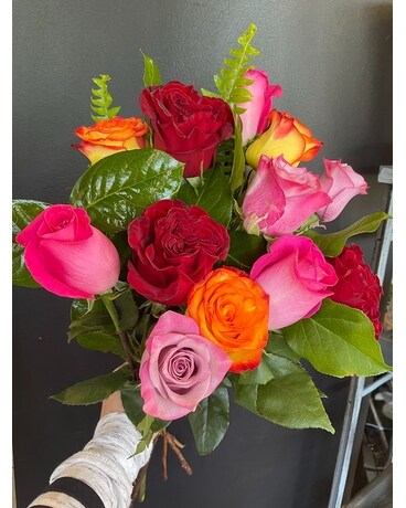 Dozen assorted wrapped rose special size, inches height and inches wide.