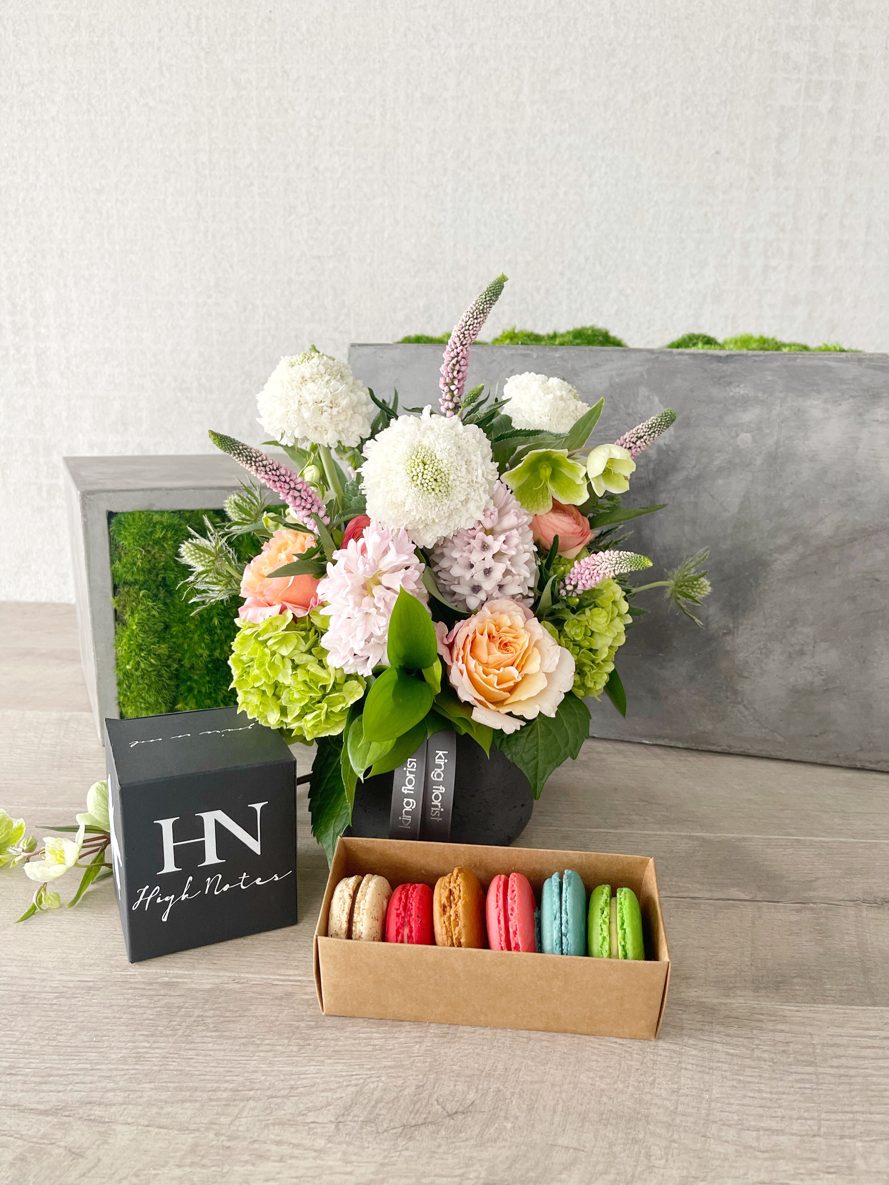 Floral Arrangement, Half Dozen Macarons, and Candle size, inches height and inches wide.
