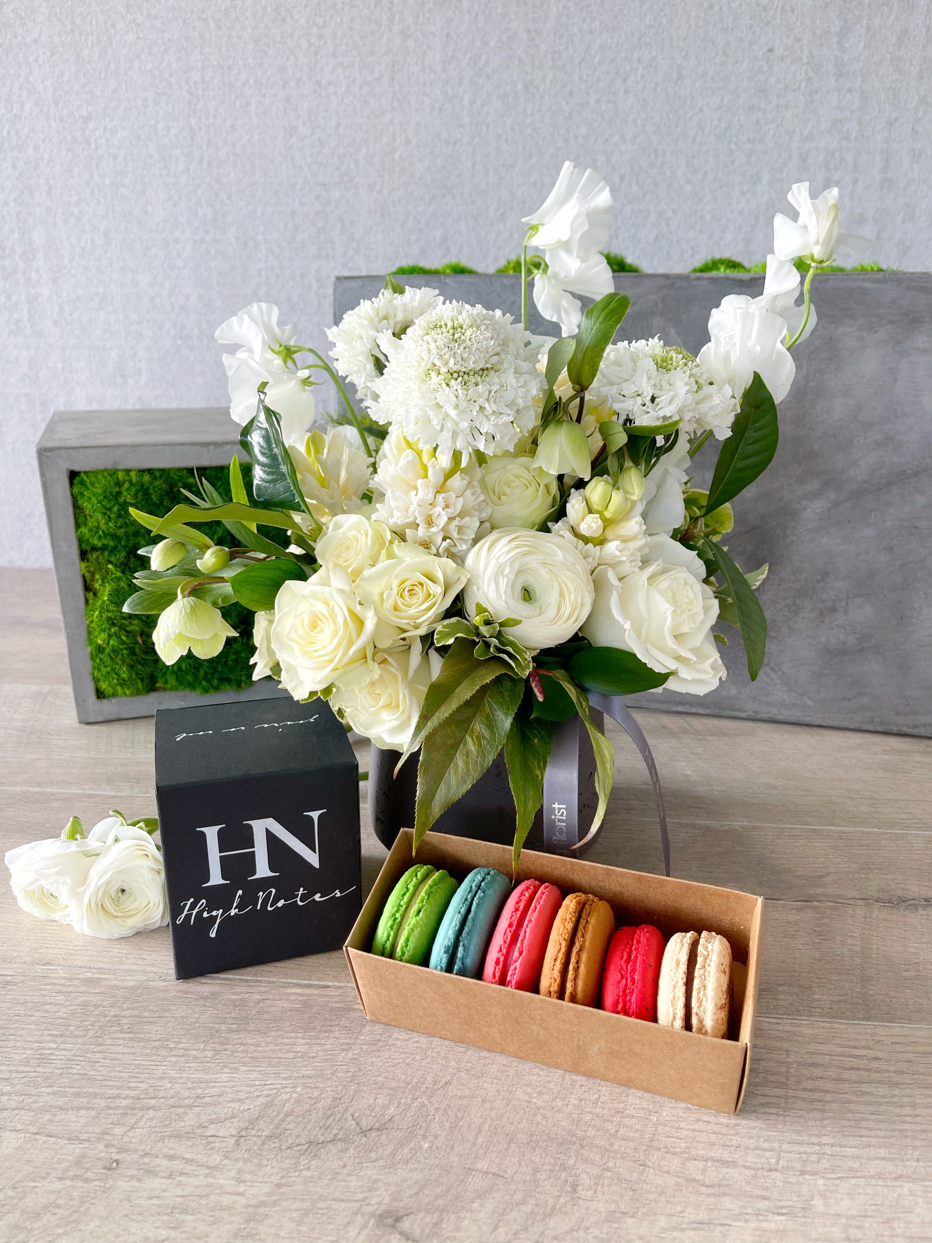 Floral Arrangement, Half Dozen Macarons, and Candle size, inches height and inches wide.