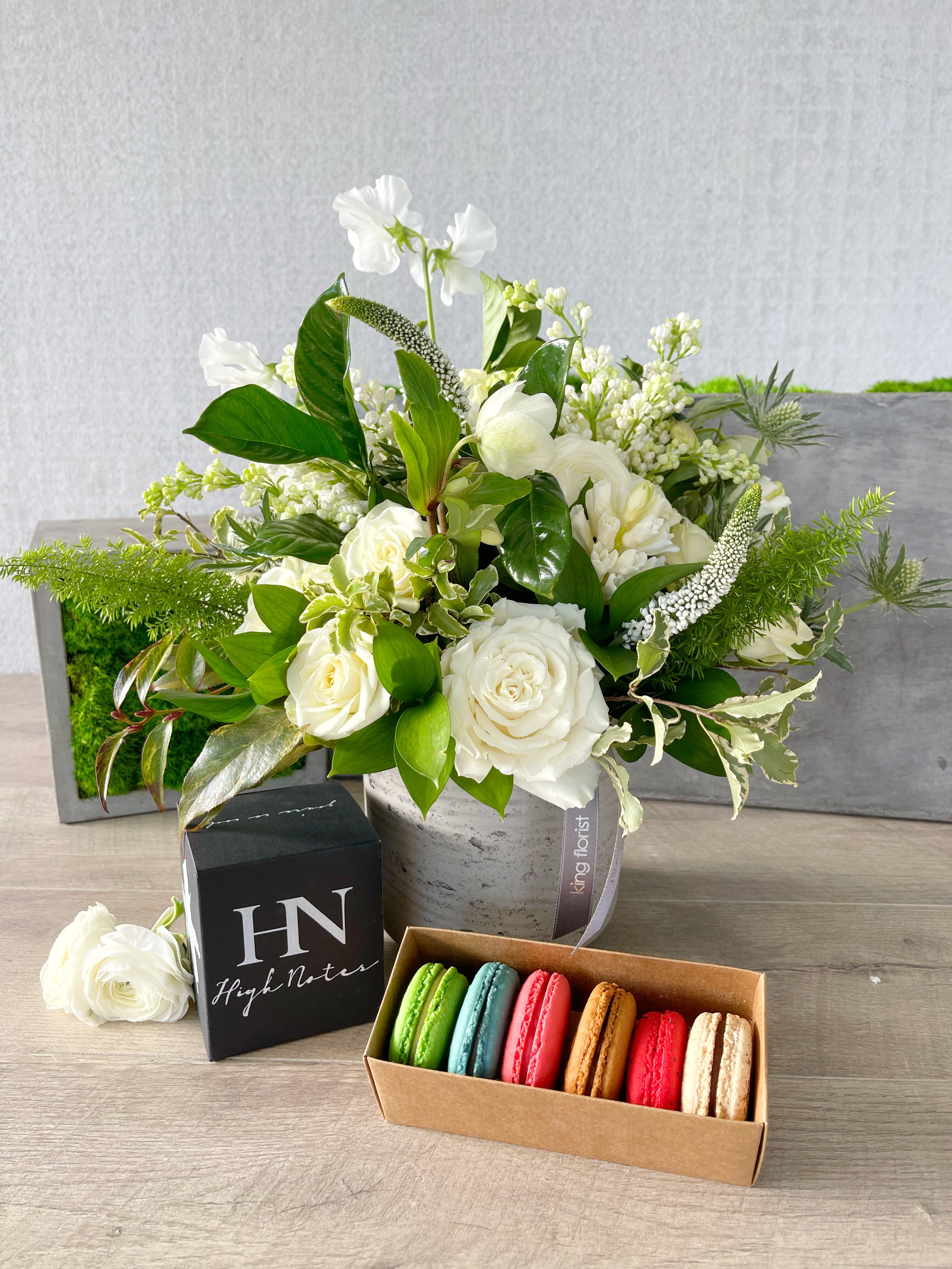 Floral Arrangement, Half Dozen Macarons, and Candle size, inches height and inches wide.