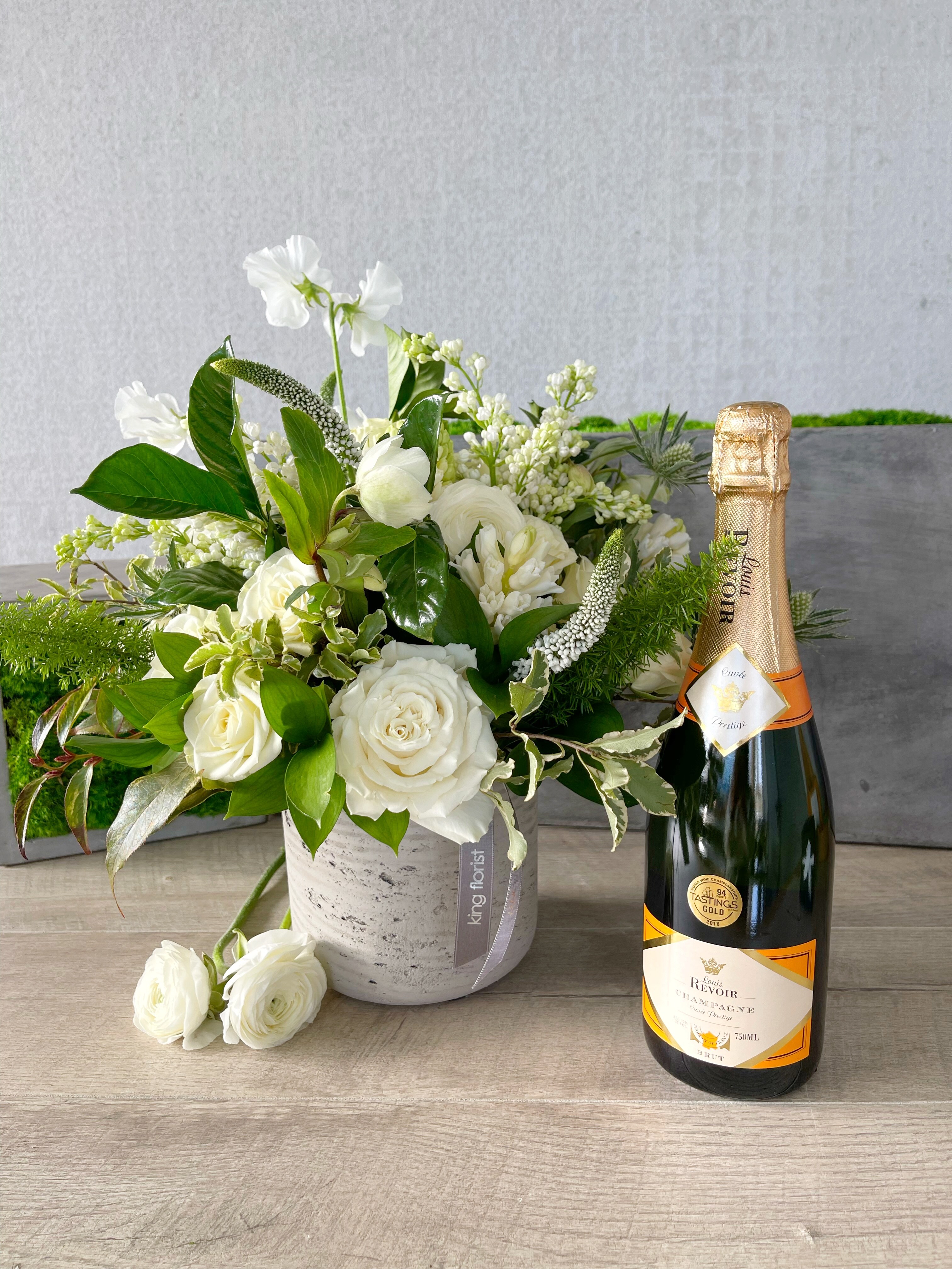 Floral Arrangement and Champagne size, inches height and inches wide.