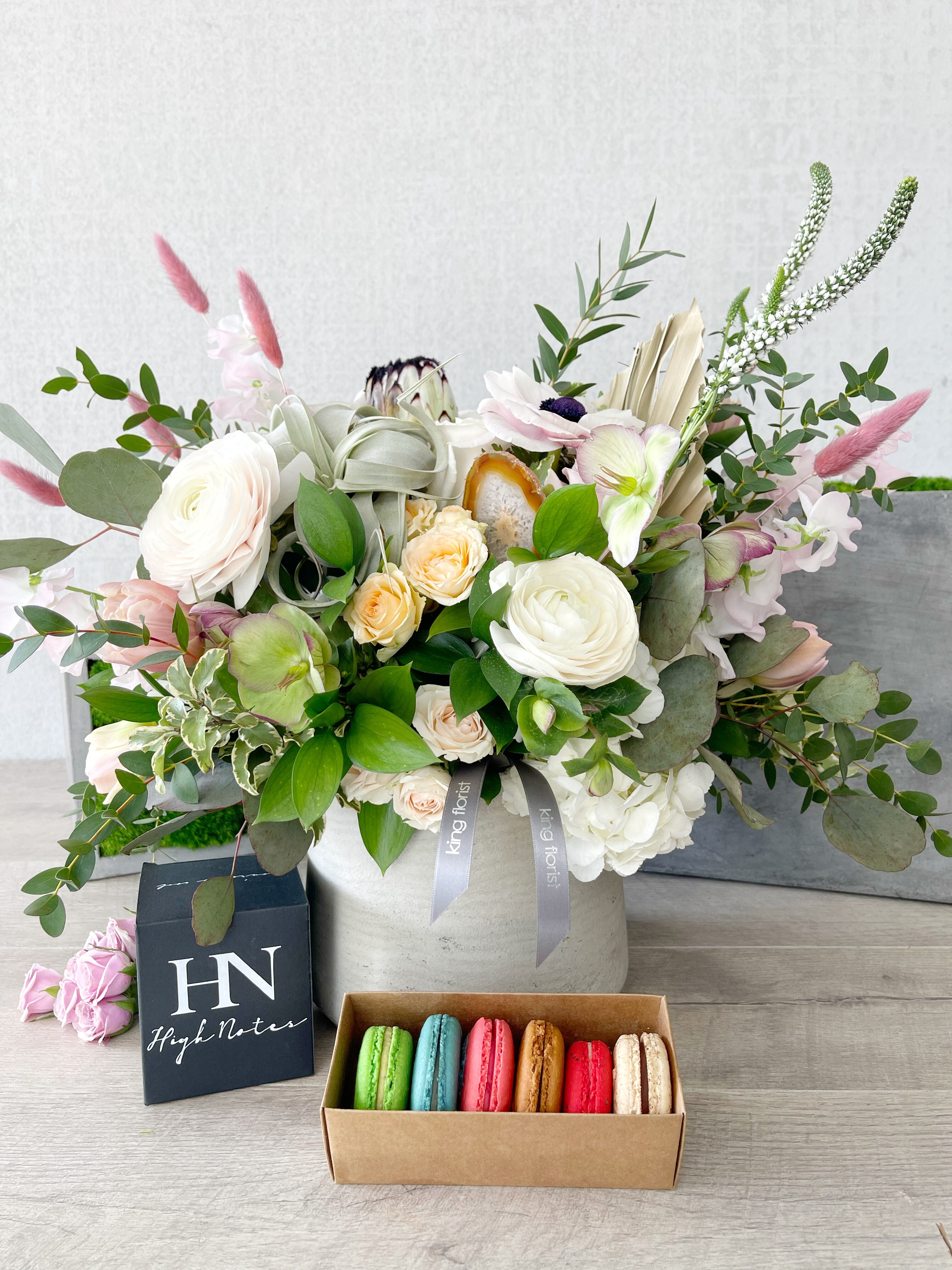 Floral Arrangement, Half Dozen Macarons, and Candle size, inches height and inches wide.