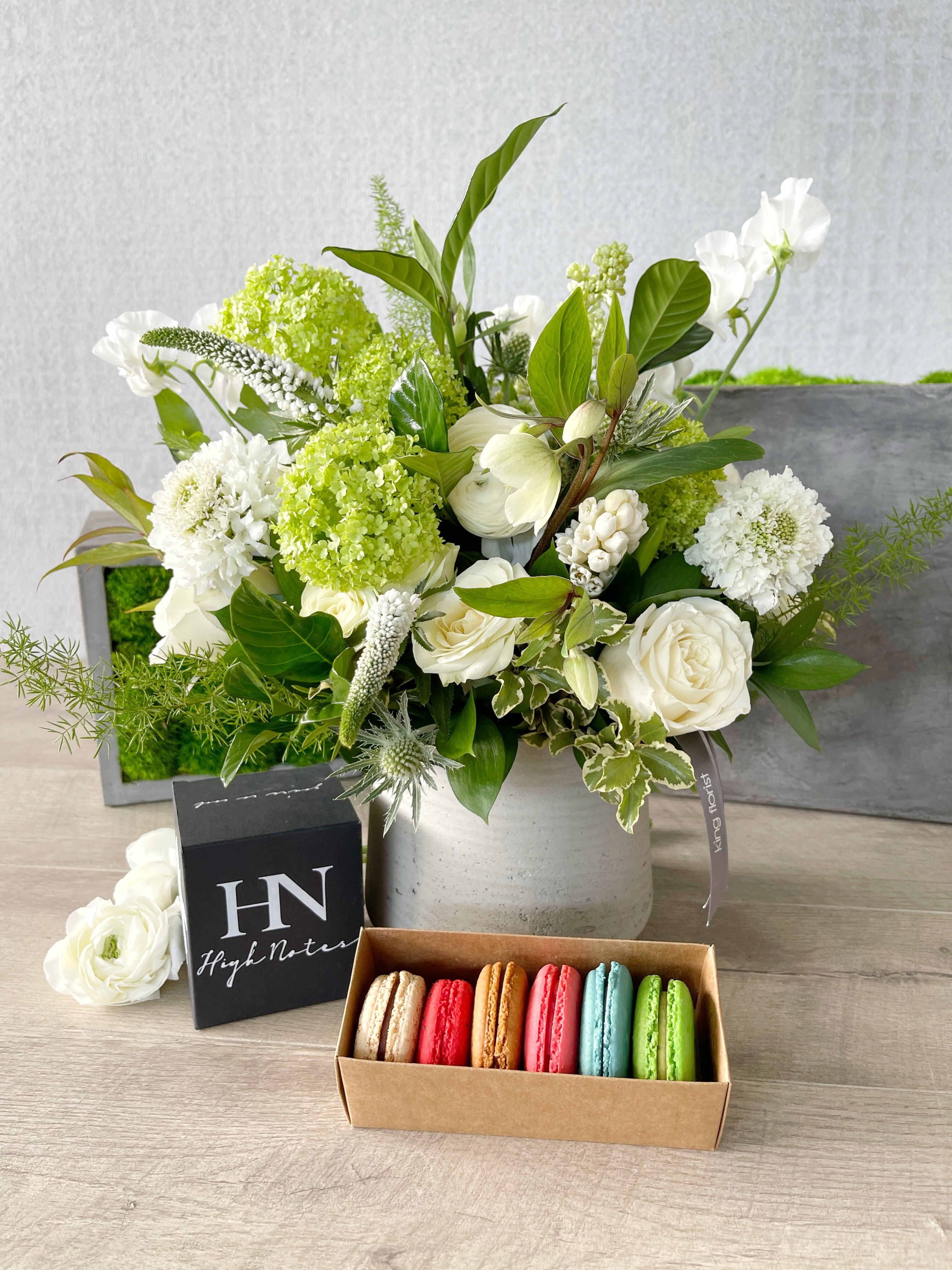 Floral Arrangement, Half Dozen Macarons, and Candle size, inches height and inches wide.