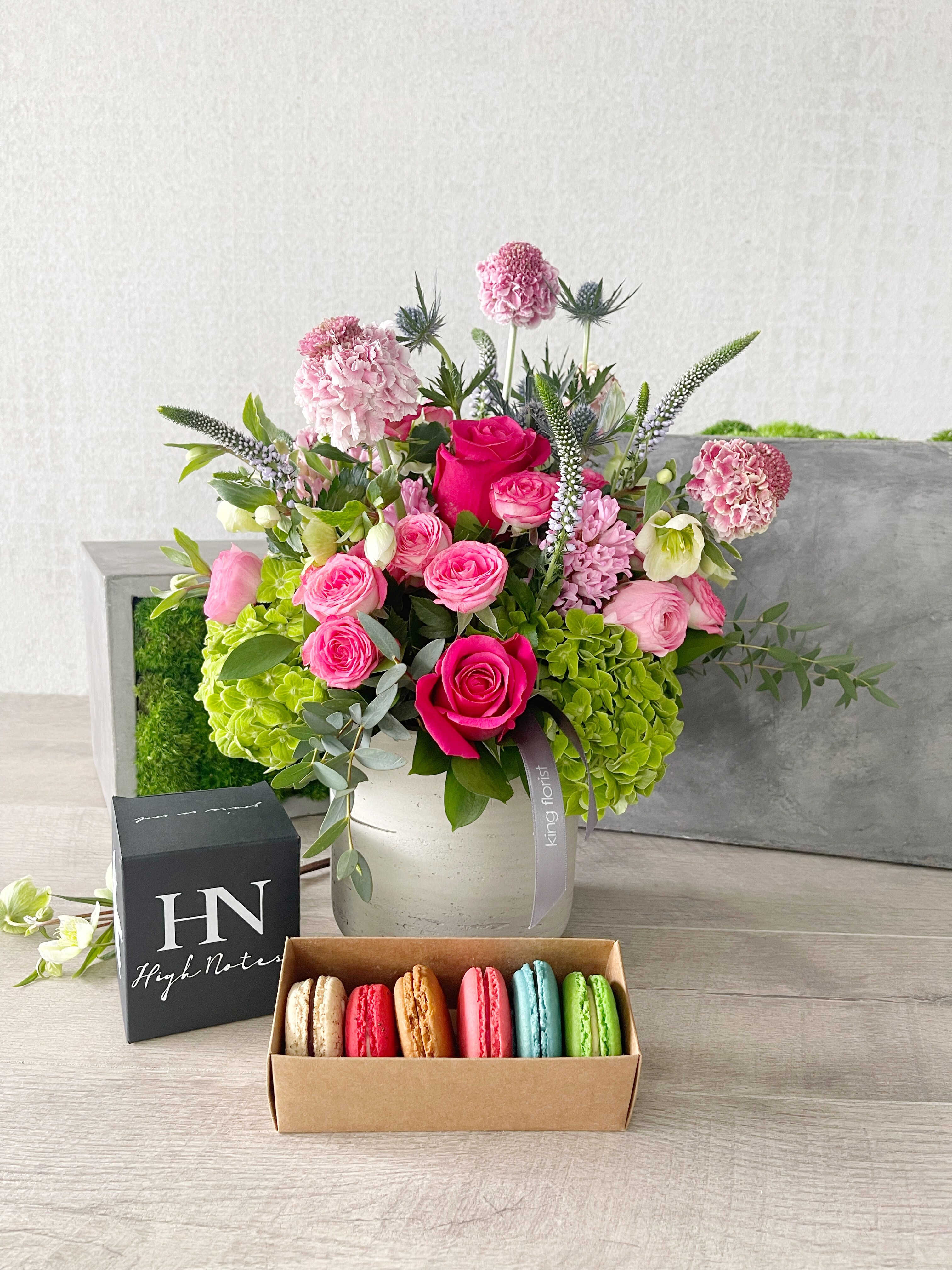 Floral Arrangement, Half Dozen Macarons, and Candle size, inches height and inches wide.