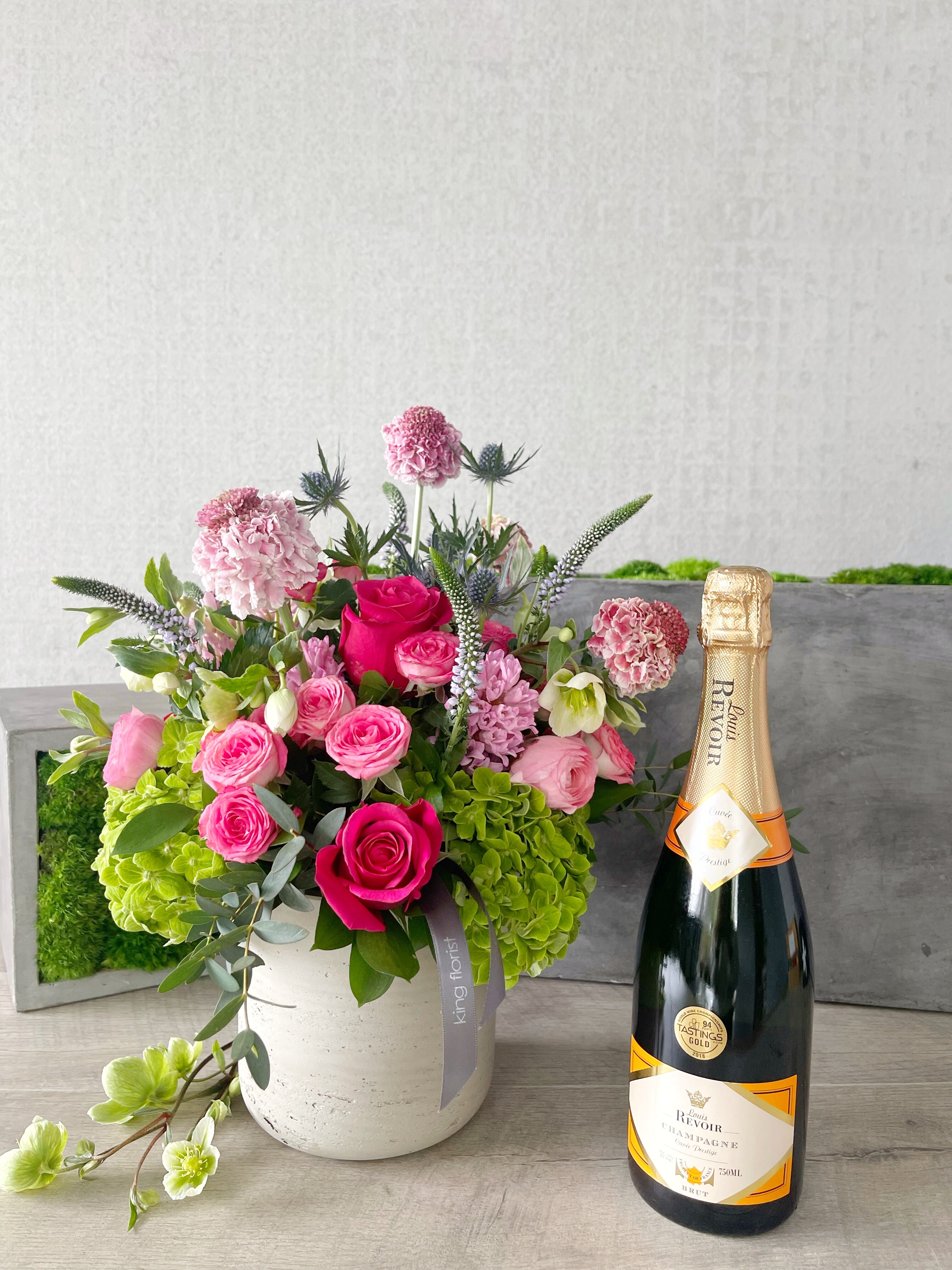 Floral Arrangement and Champagne size, inches height and inches wide.