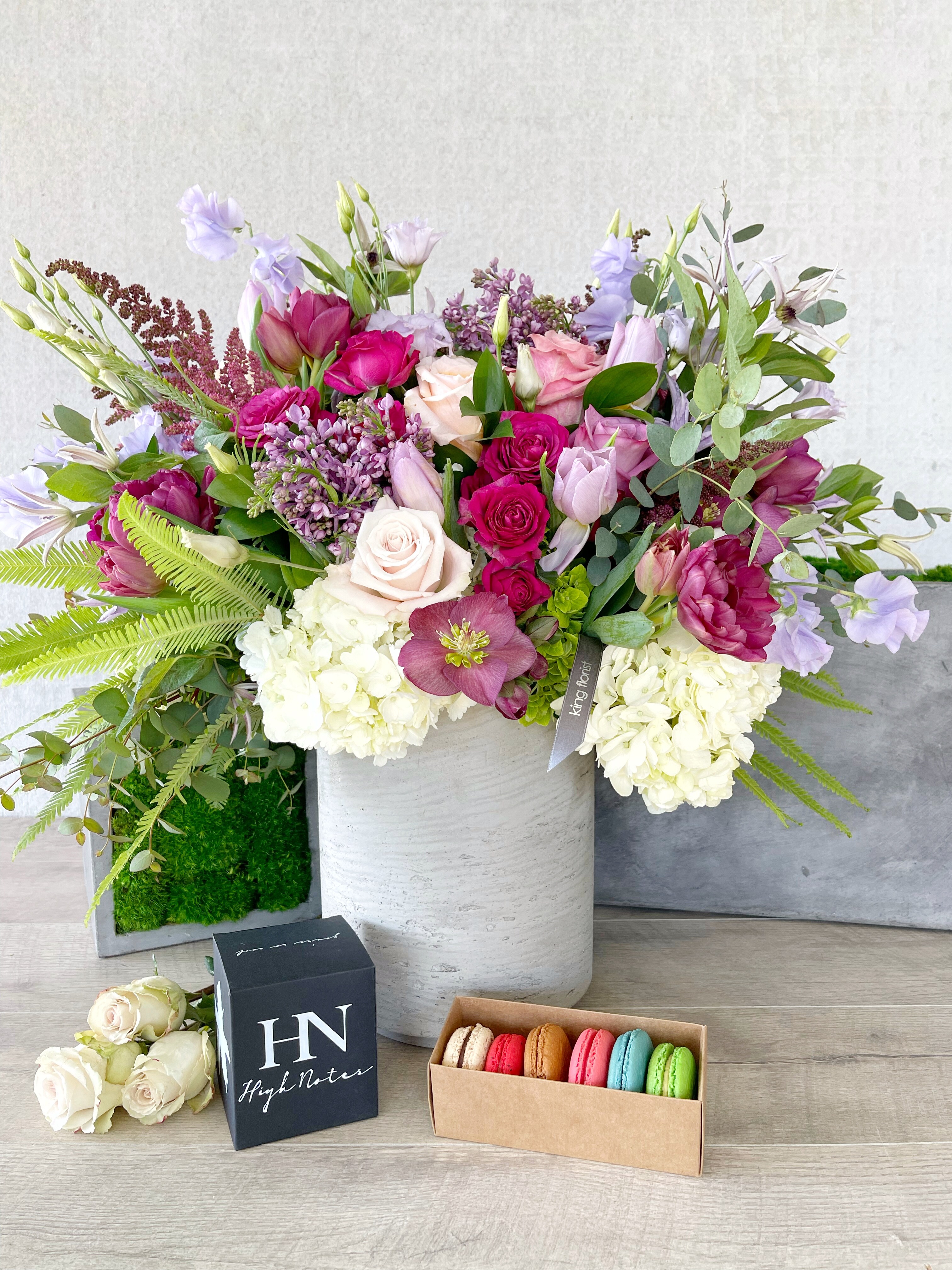 Floral Arrangement, Half Dozen Macarons, and Candle size, inches height and inches wide.