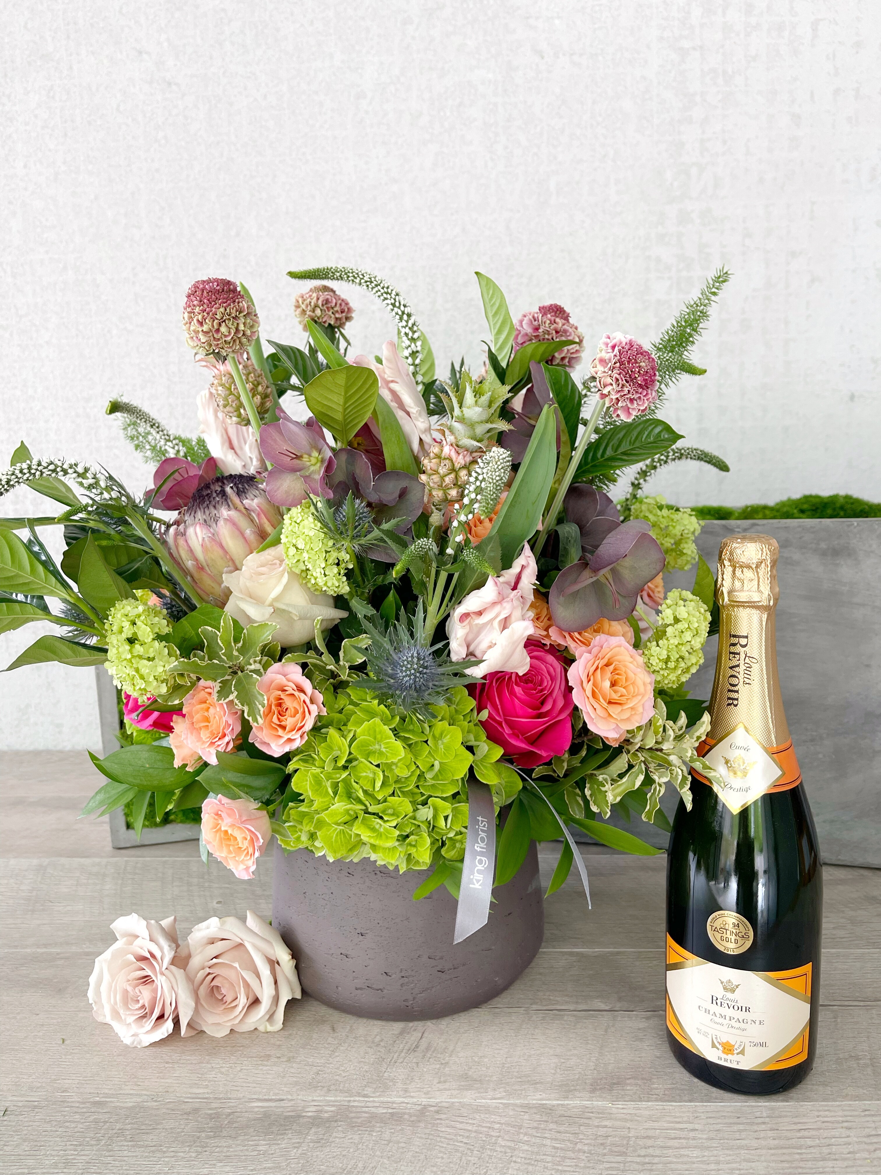 Floral Arrangement and Champagne size, inches height and inches wide.