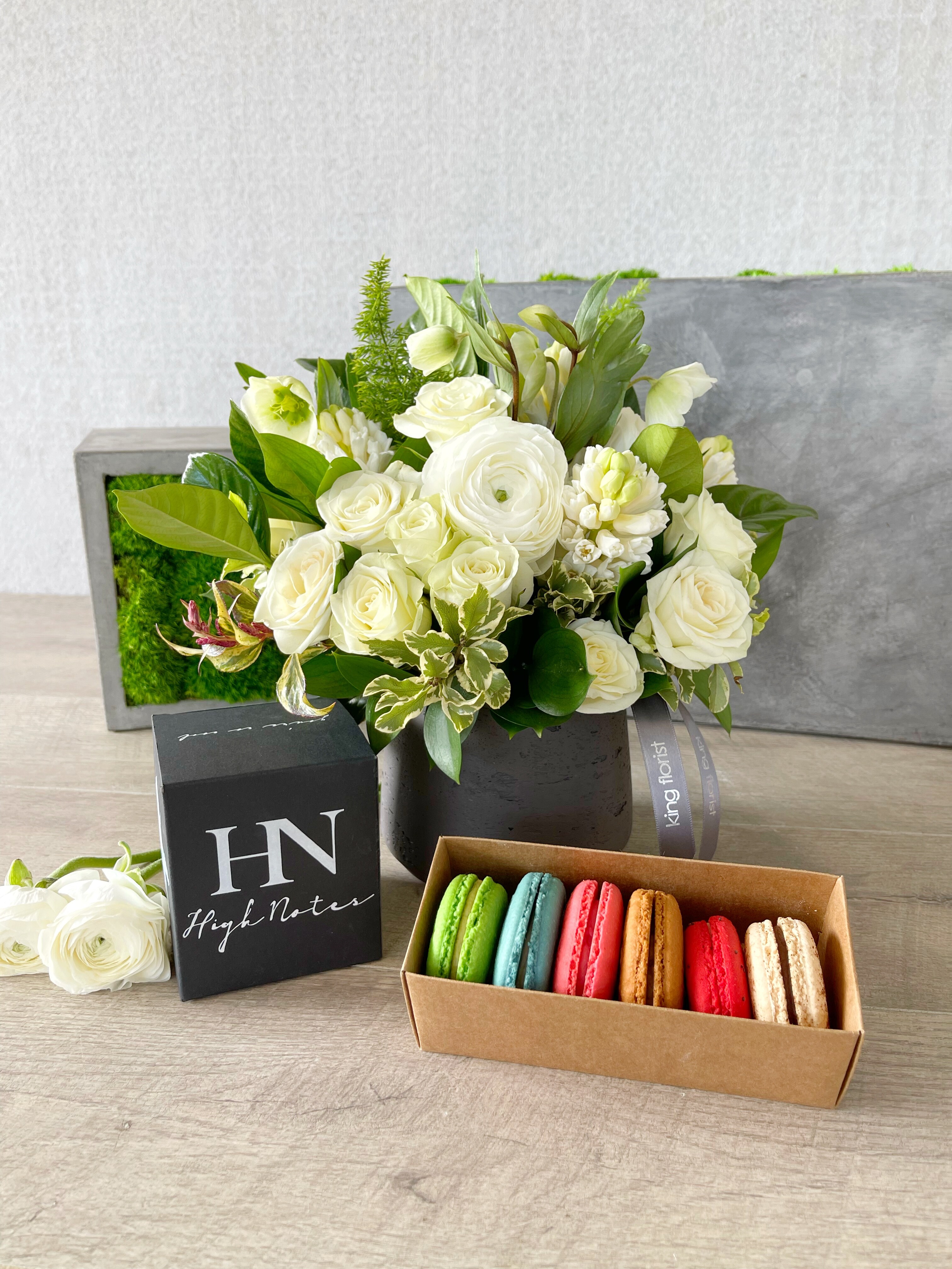 Floral Arrangement, Macarons and a Candle size, inches height and inches wide.