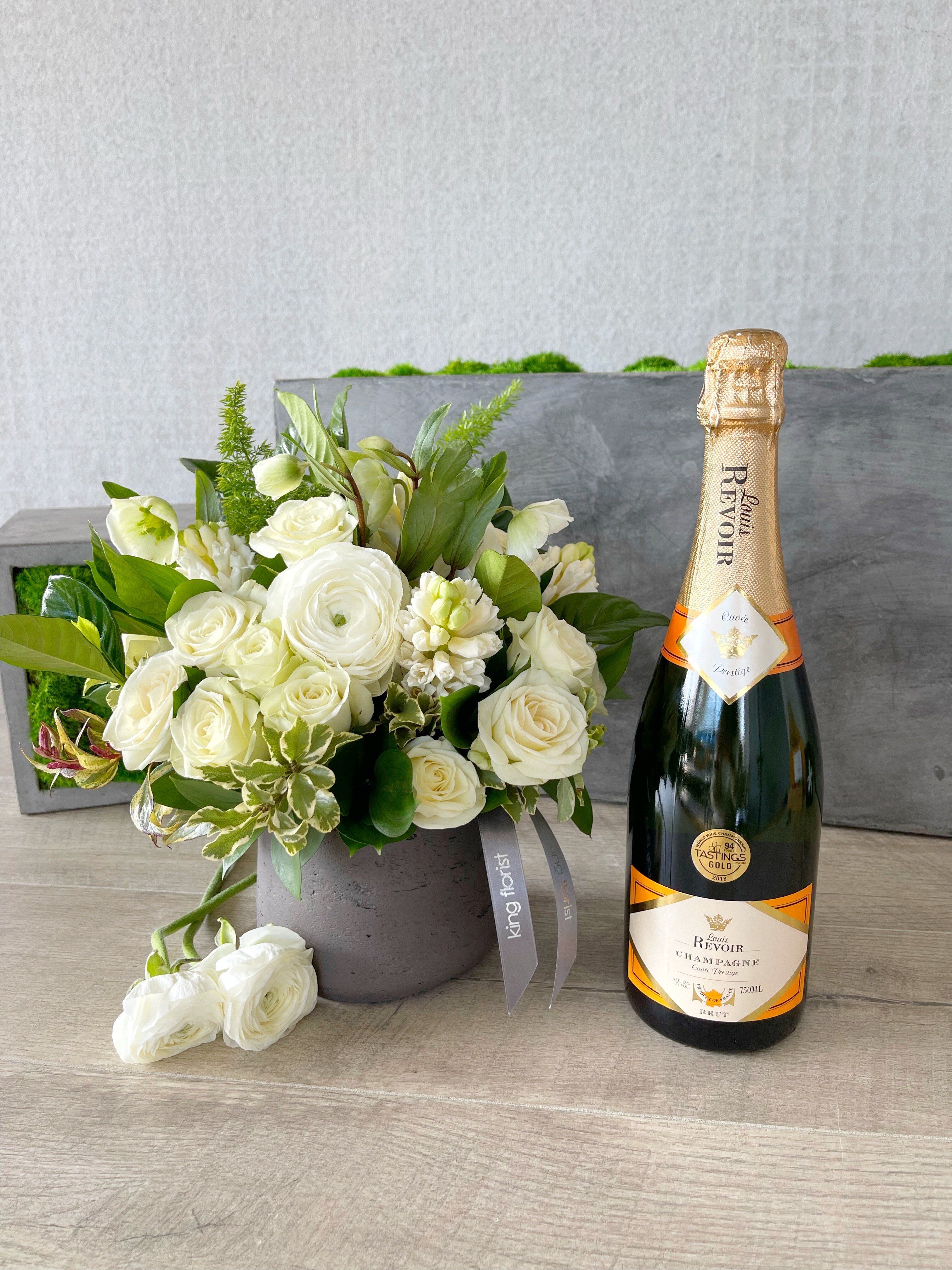 Floral Arrangement and Champagne size, inches height and inches wide.
