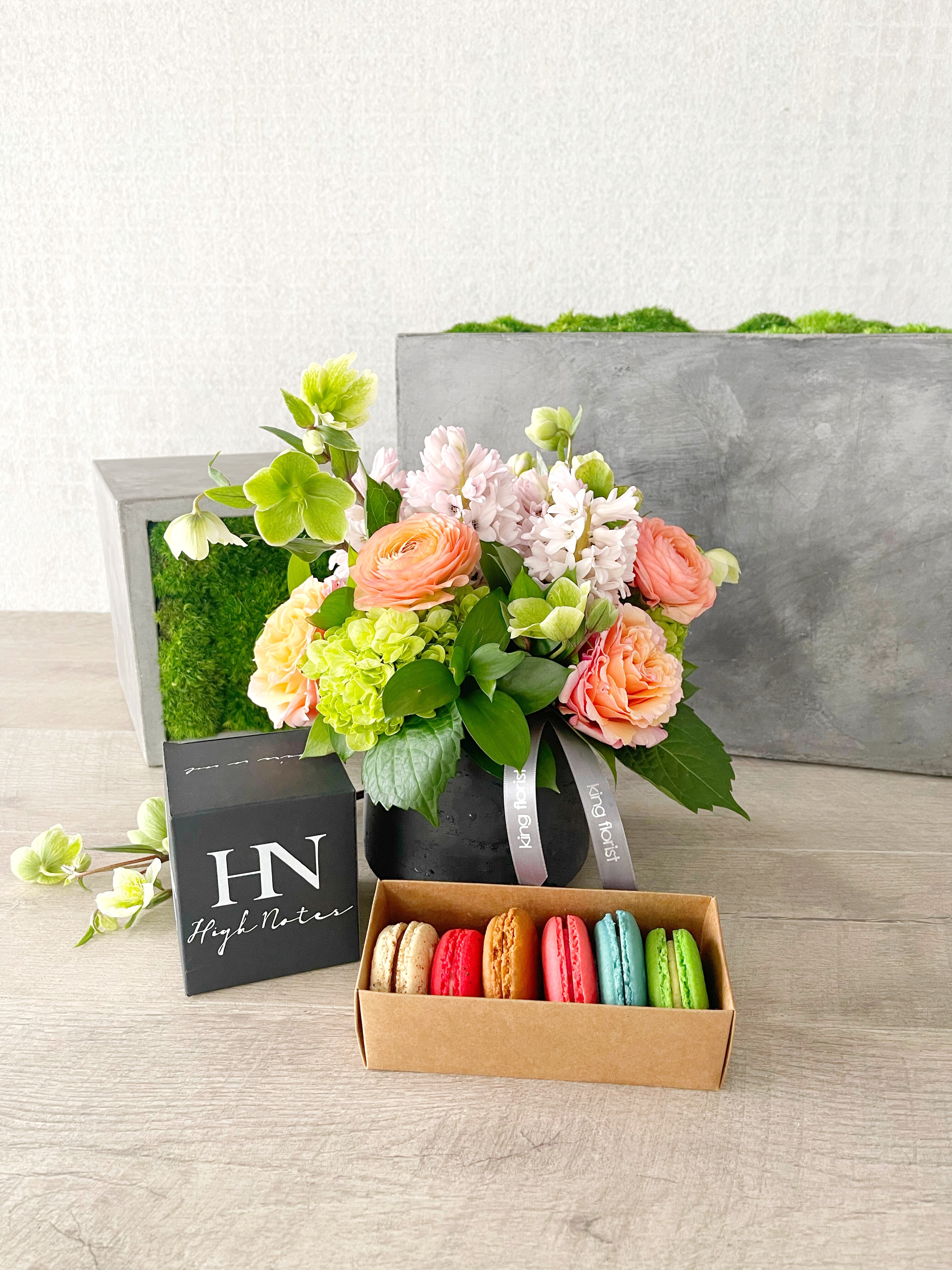 Floral Arrangement, Macarons and a Candle size, inches height and inches wide.