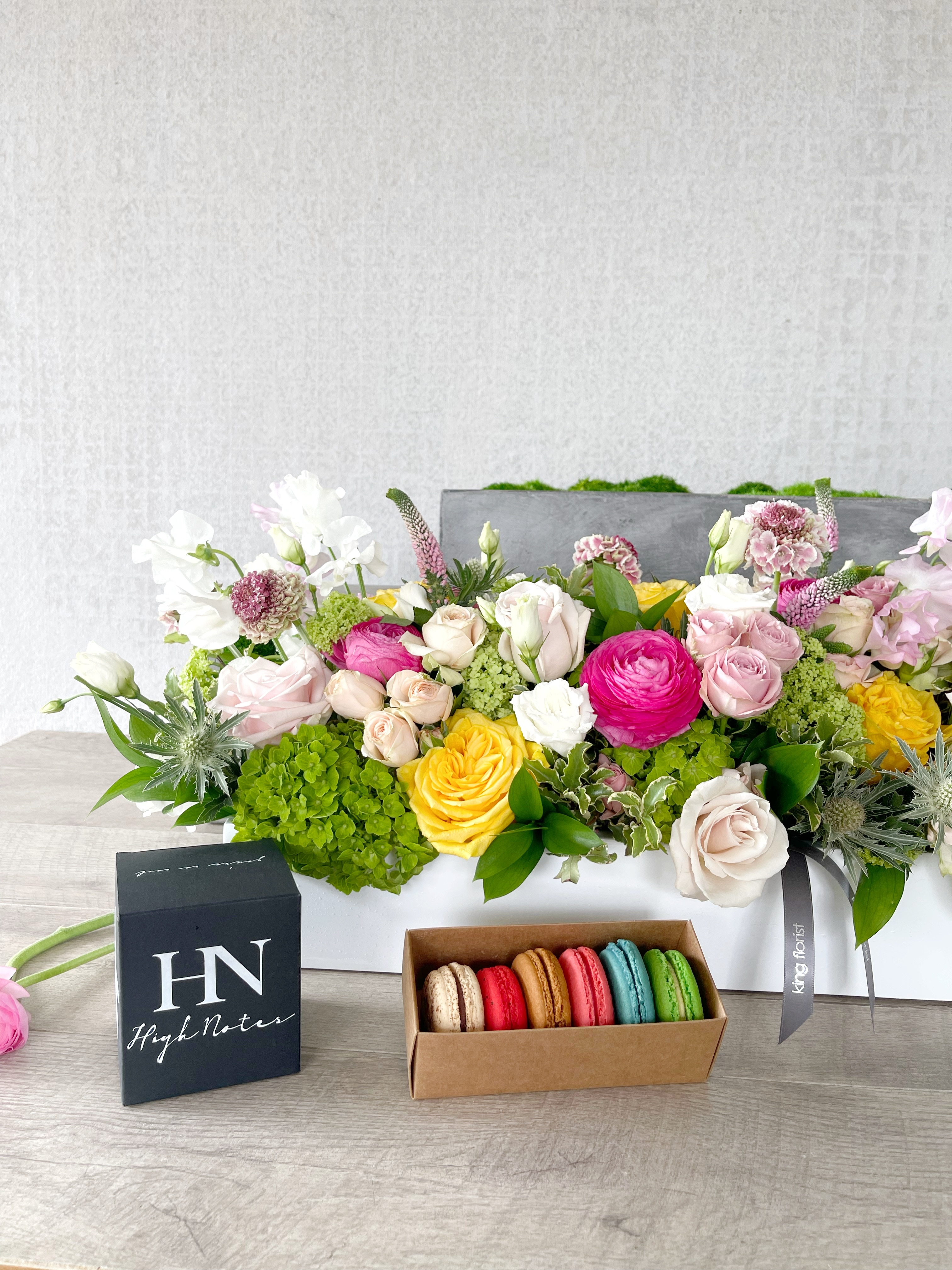 Floral Arrangement, Half dozen Macarons, and Candle size, inches height and inches wide.