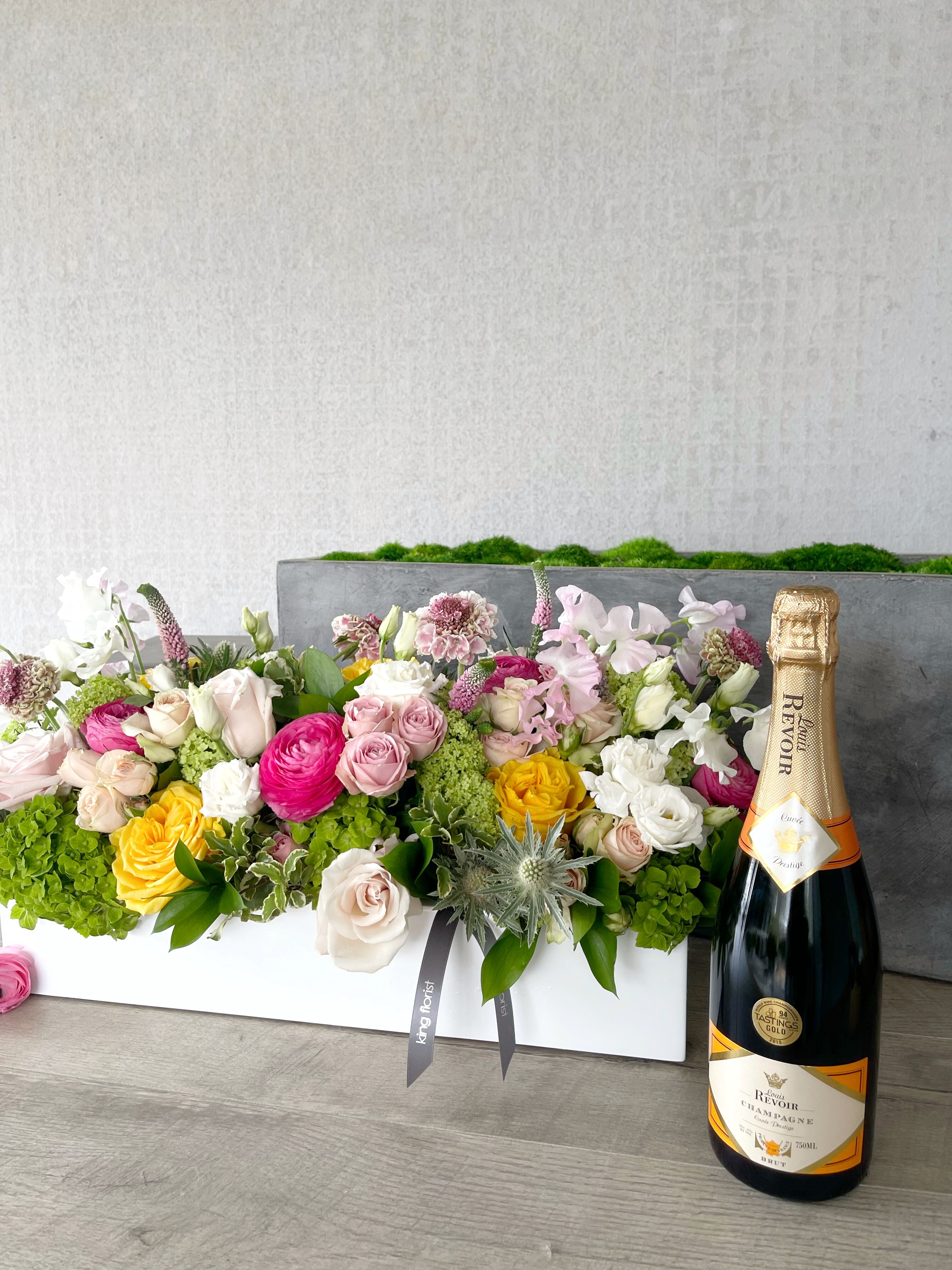 Floral Arrangement and Champagne size, inches height and inches wide.