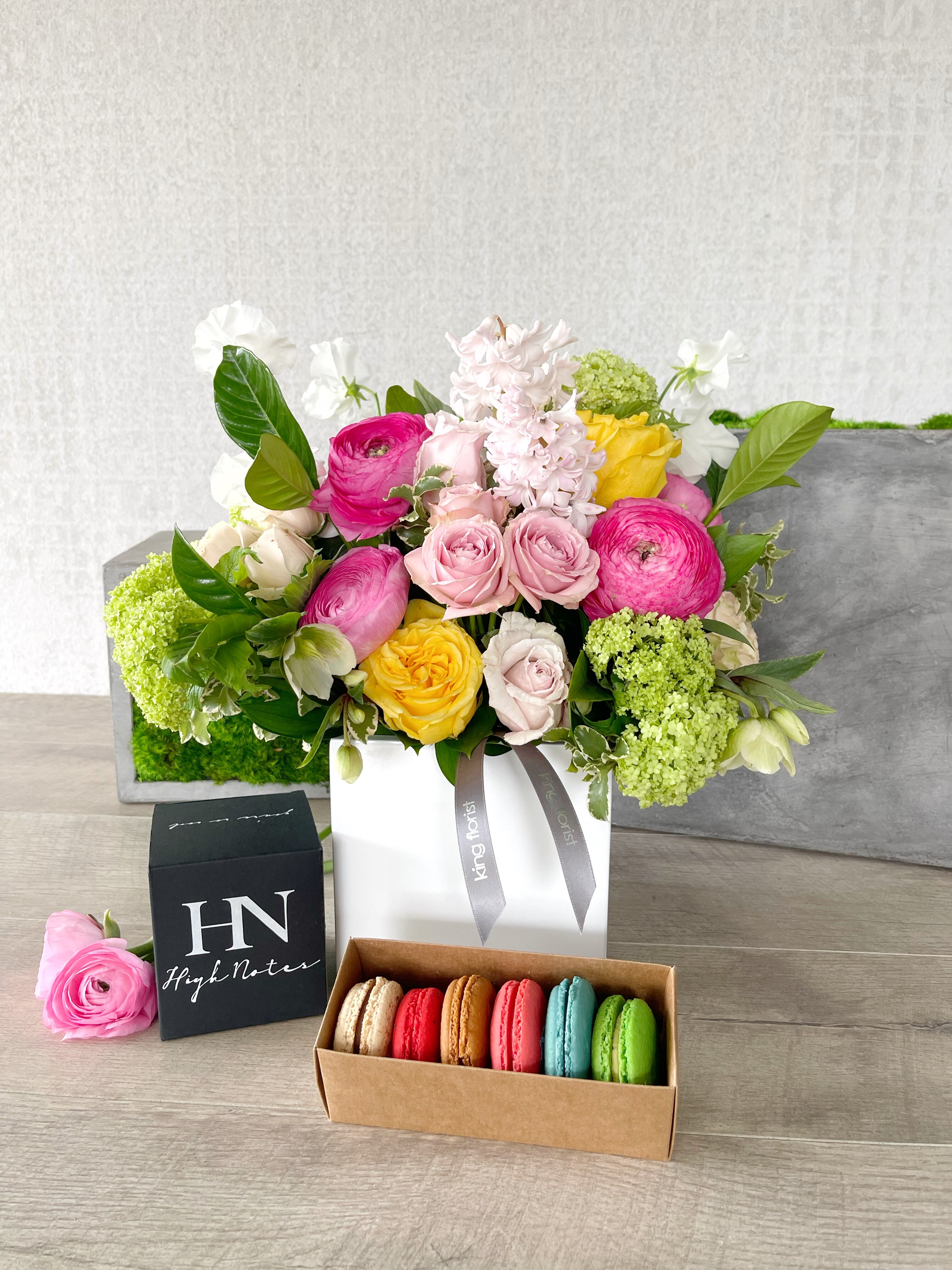 Floral Arrangement, Half dozen Macarons, and Candle size, inches height and inches wide.