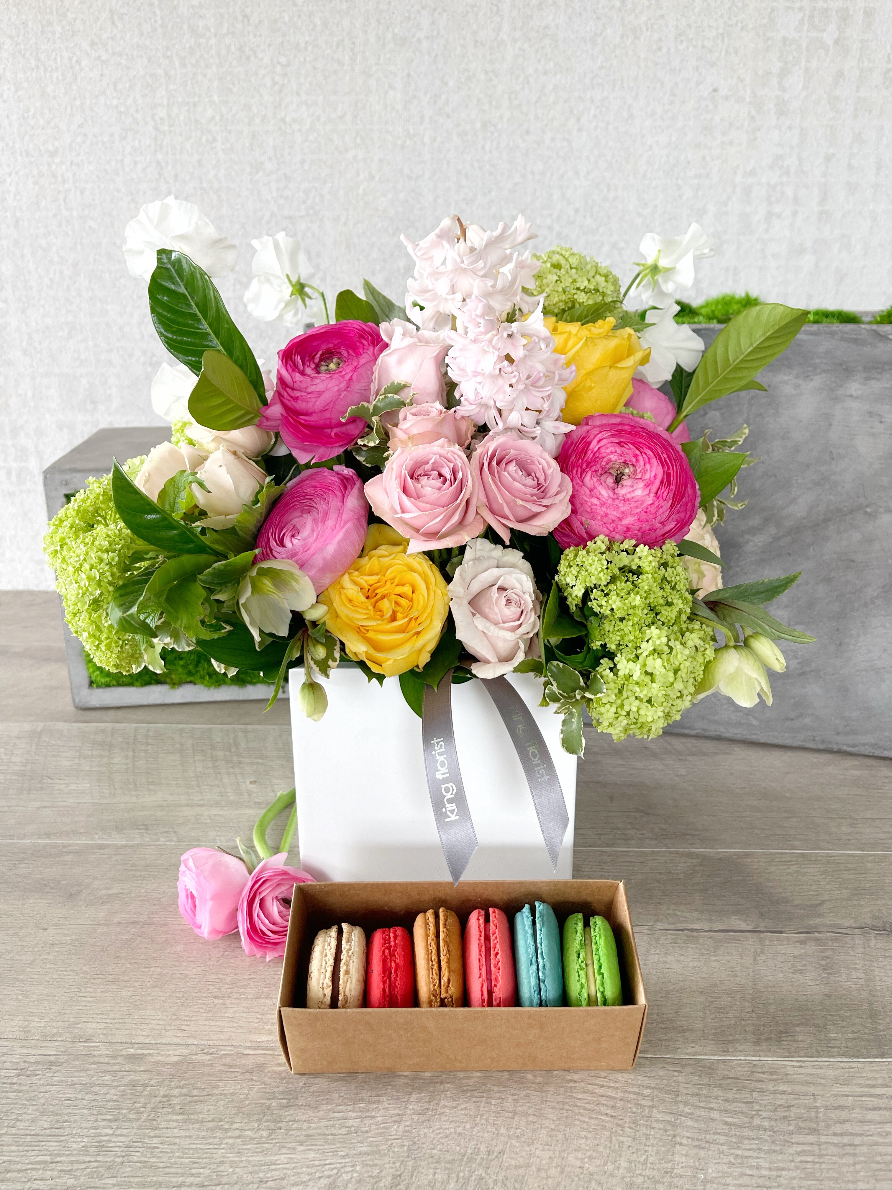 Floral Arrangement and Half Dozen Macarons size, inches height and inches wide.