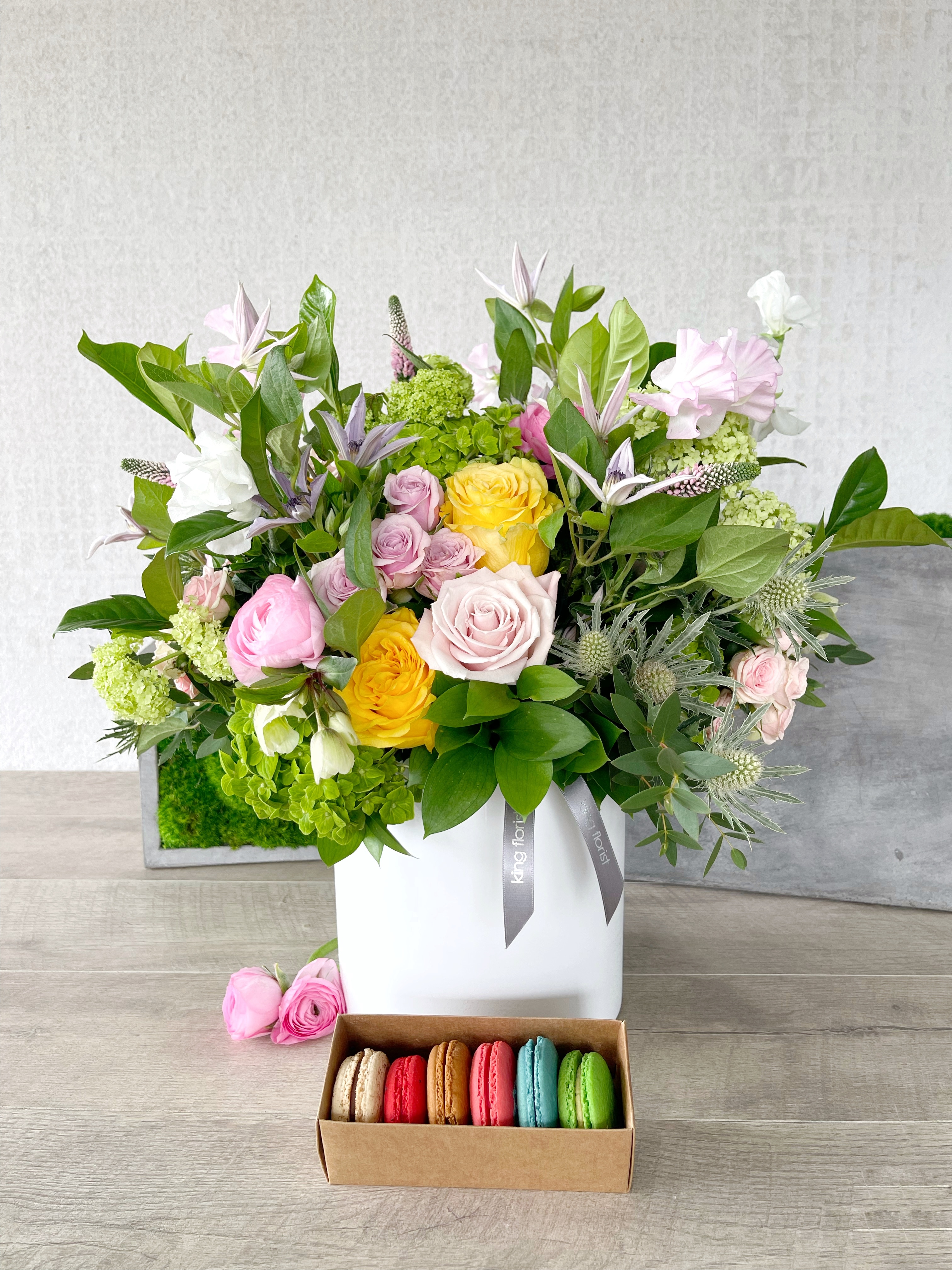 Floral Arrangement and Half Dozen Macarons size, inches height and inches wide.
