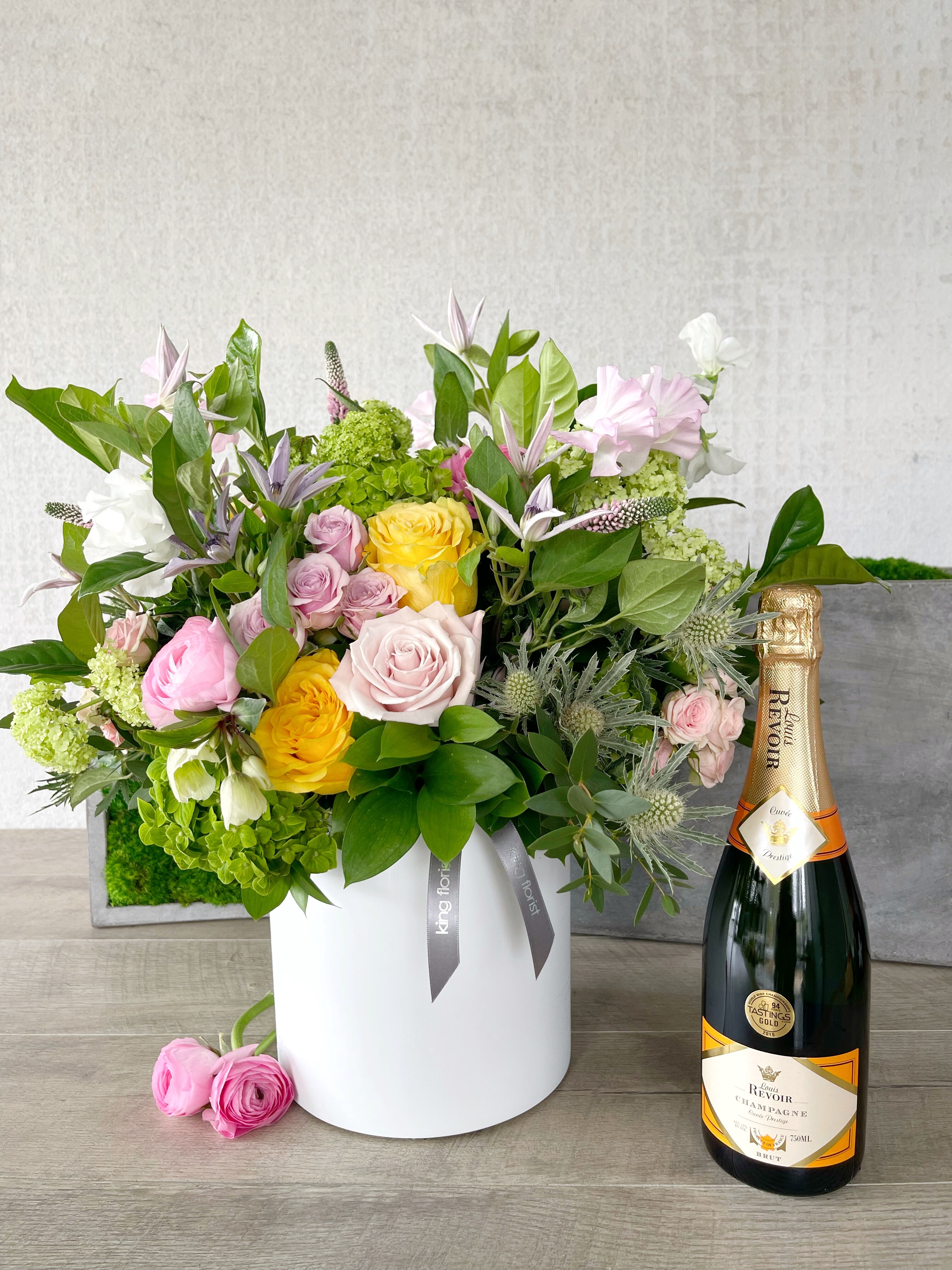 Floral Arrangement and Champagne size, inches height and inches wide.