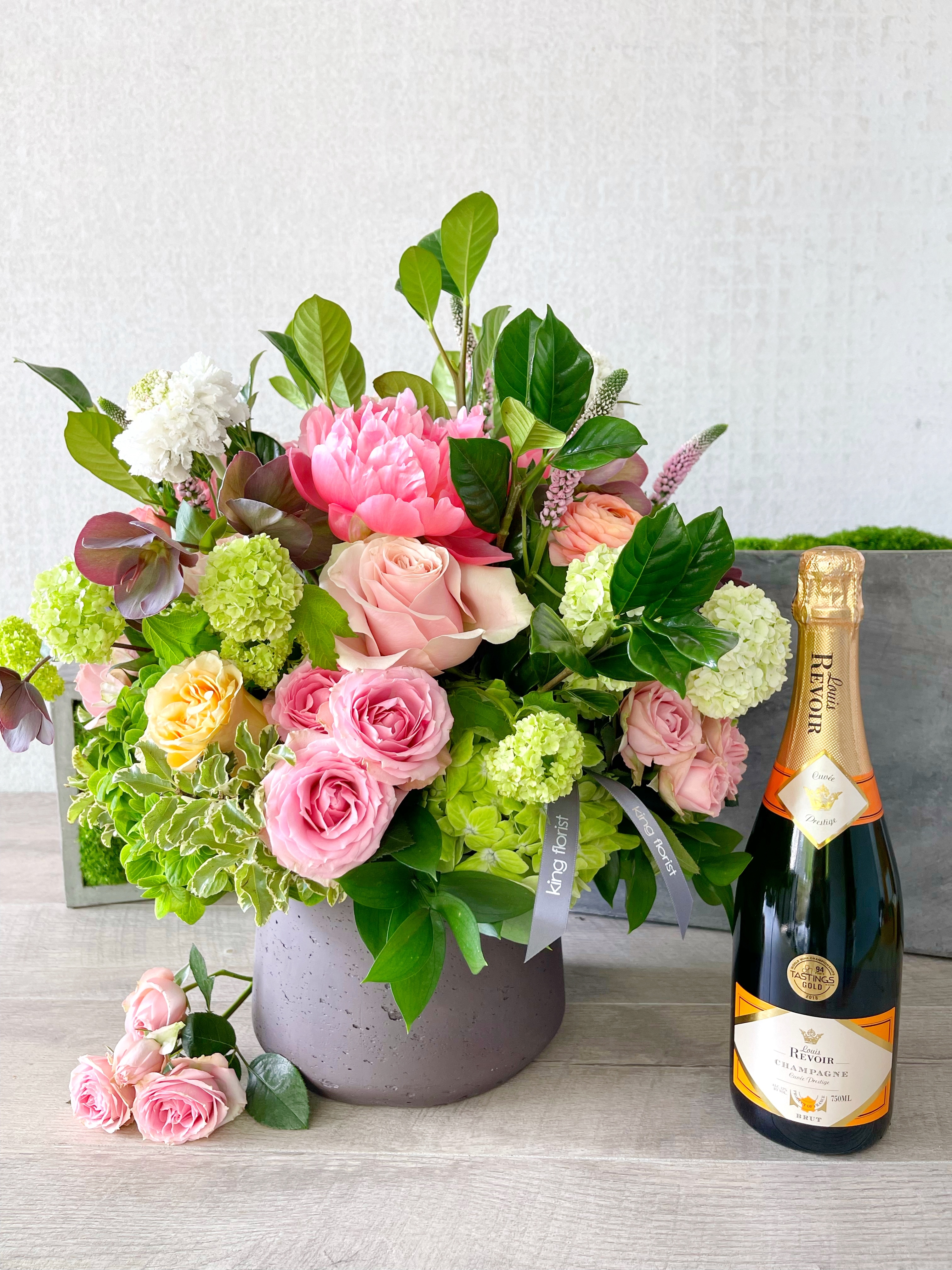 Floral Arrangement and Champagne size, inches height and inches wide.