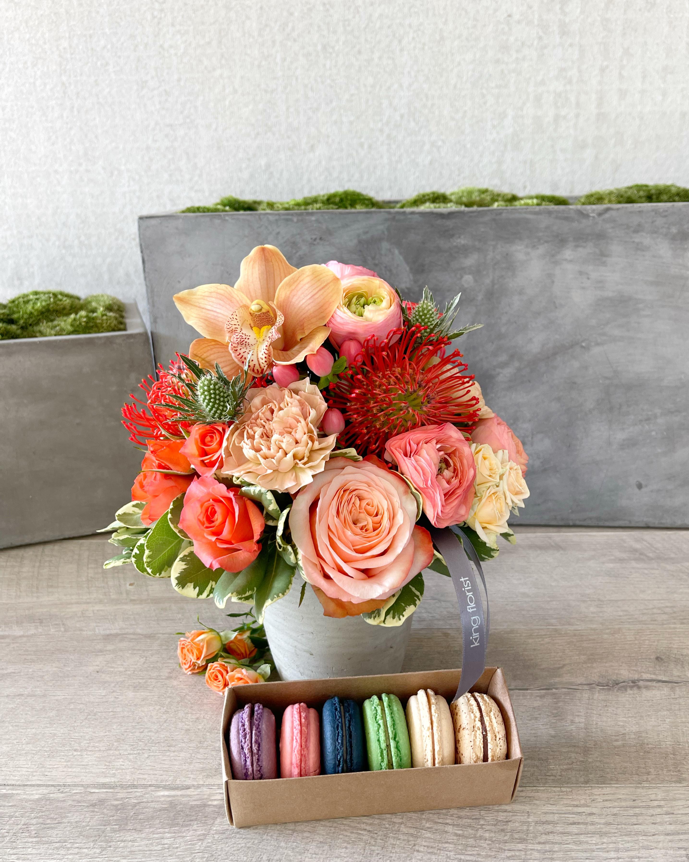 Floral Arrangement and Half dozen Macarons size, inches height and inches wide.