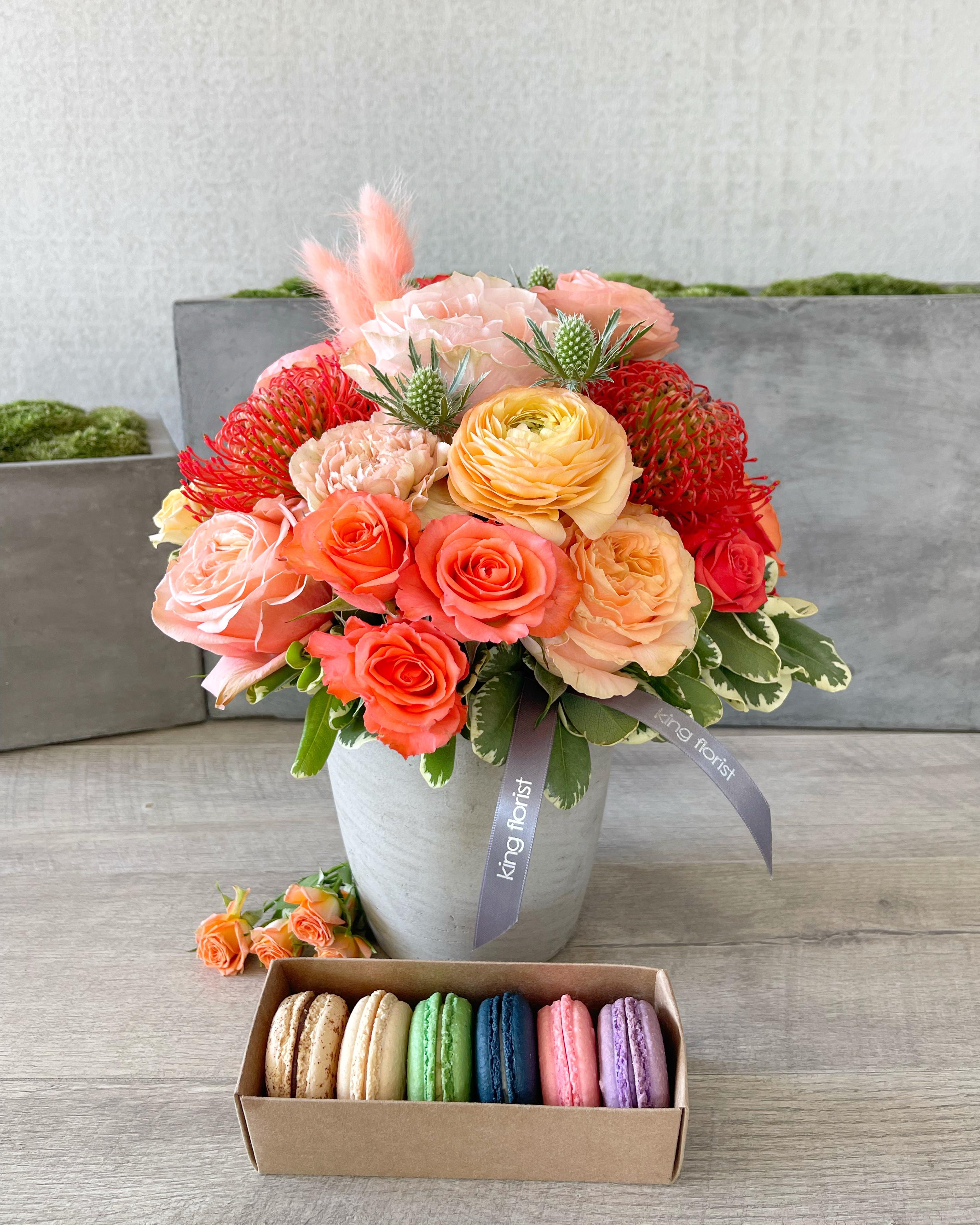 Floral Arrangement and Half dozen Macarons size, inches height and inches wide.