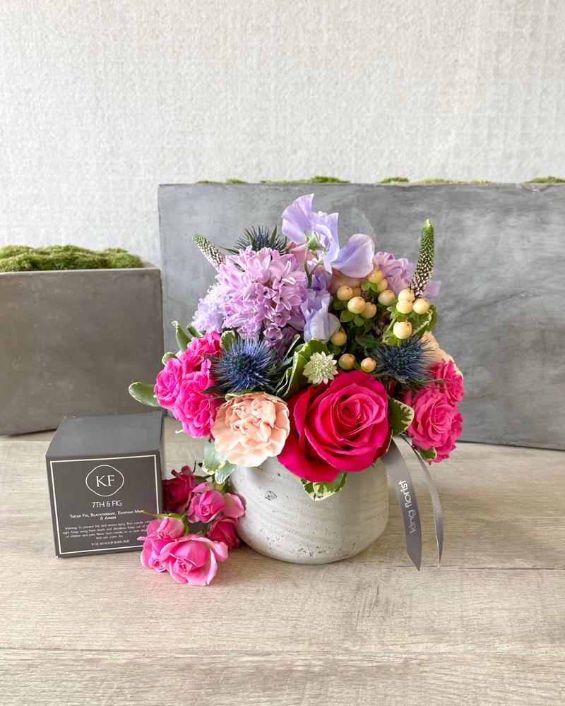 Floral Arrangement and a Candle size, inches height and inches wide.