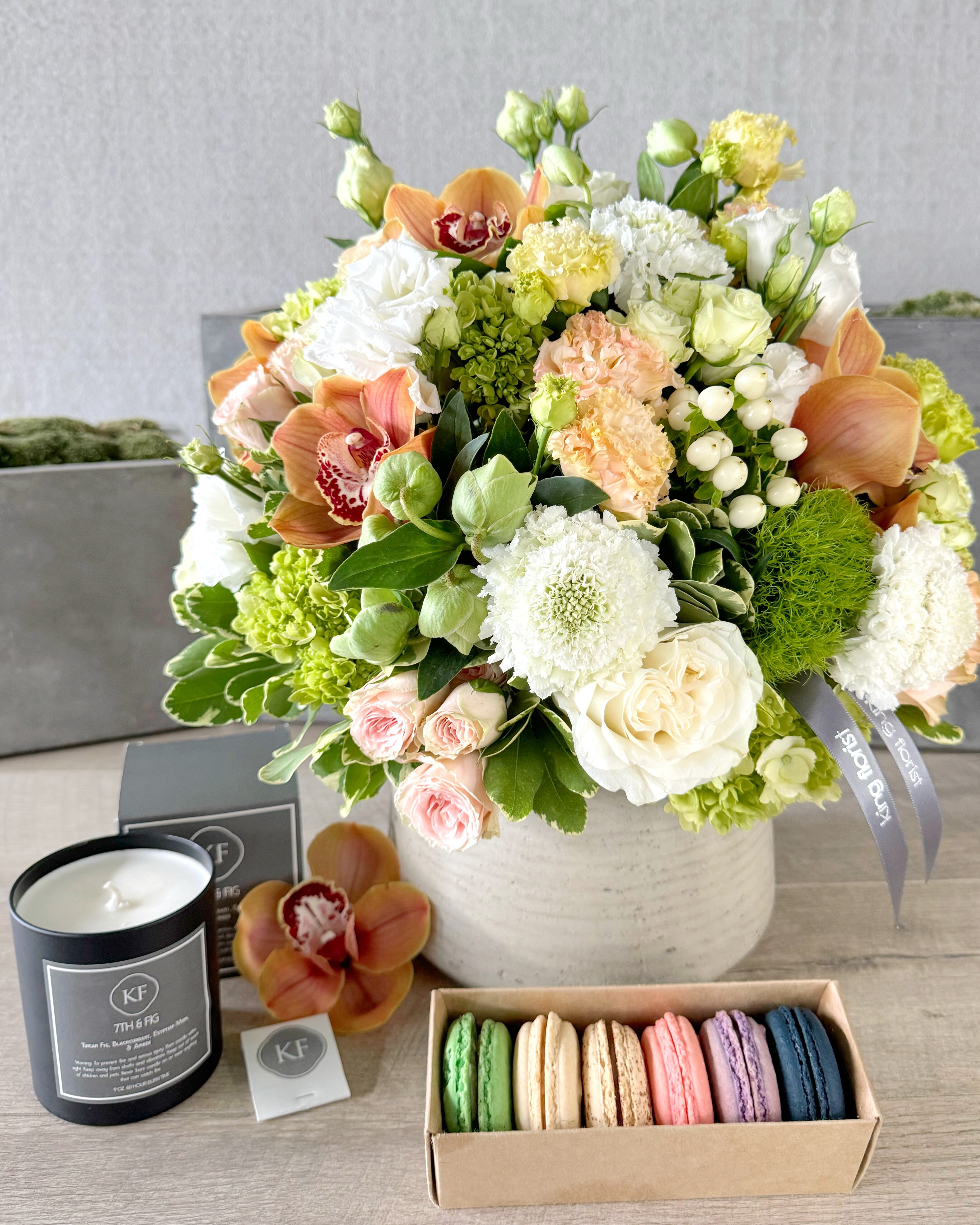 Floral Arrangements, Half Dozen Macarons, and Candle size, inches height and inches wide.
