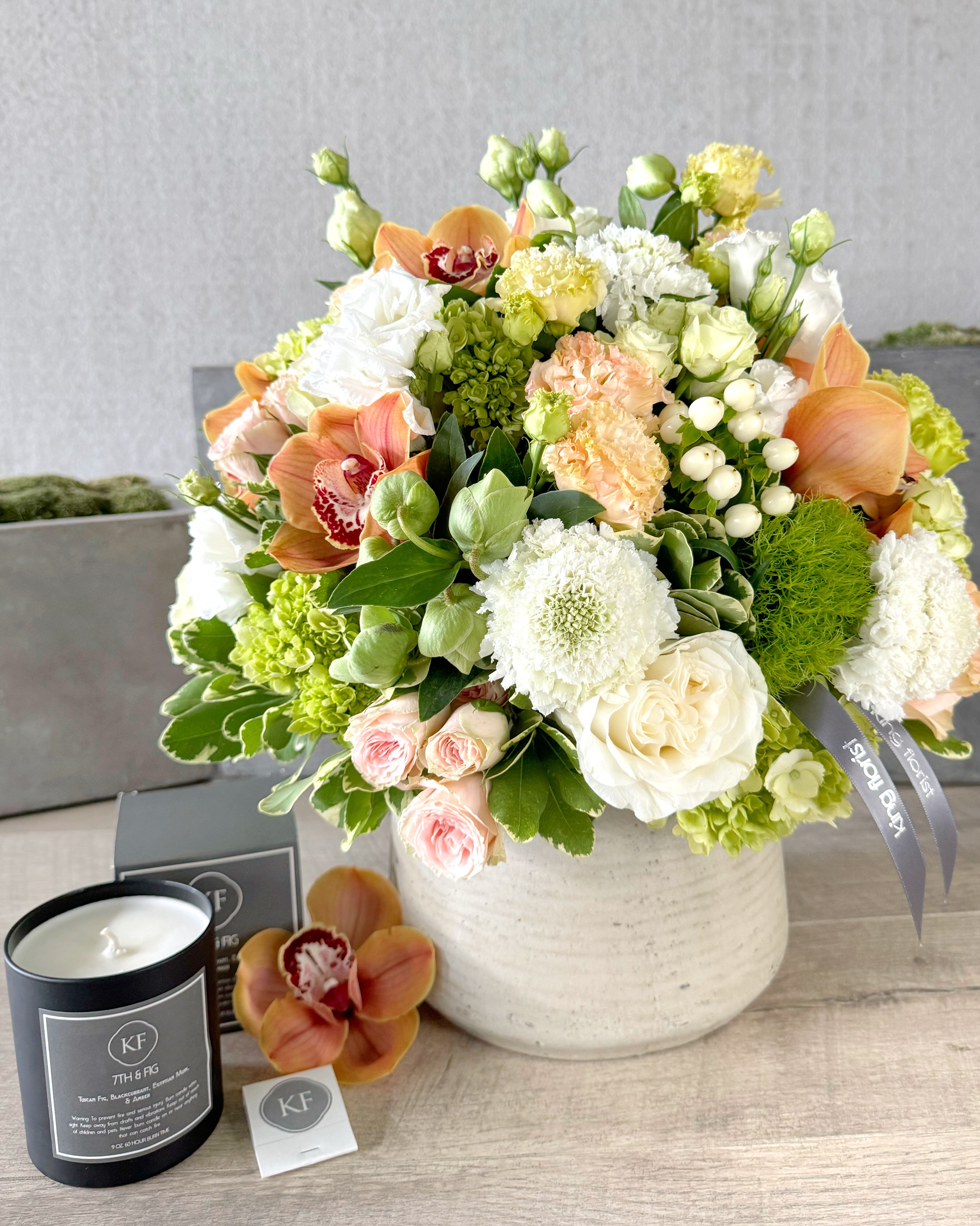 Floral Arrangement and Candle size, inches height and inches wide.