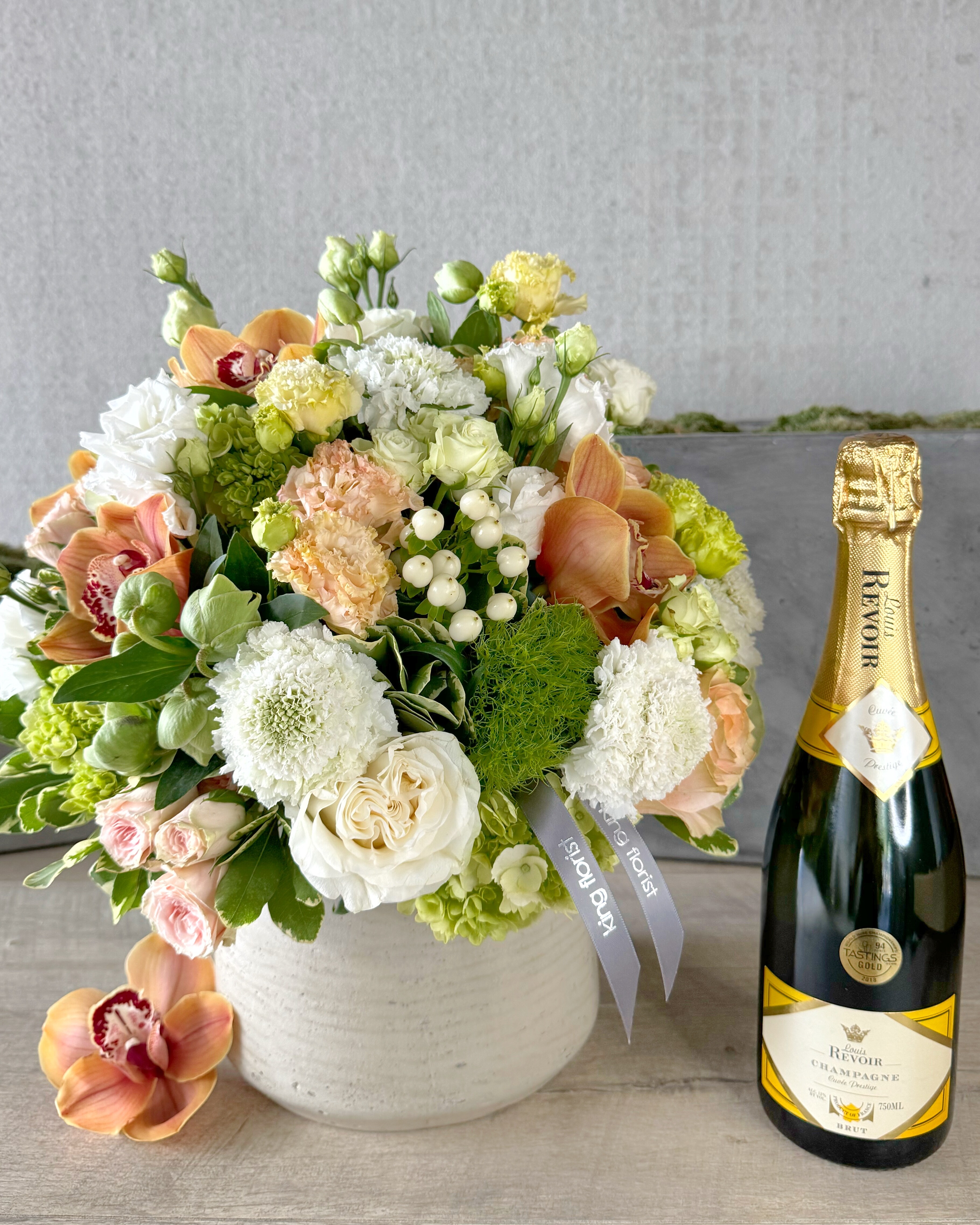 Floral Arrangement and Champagne size, inches height and inches wide.