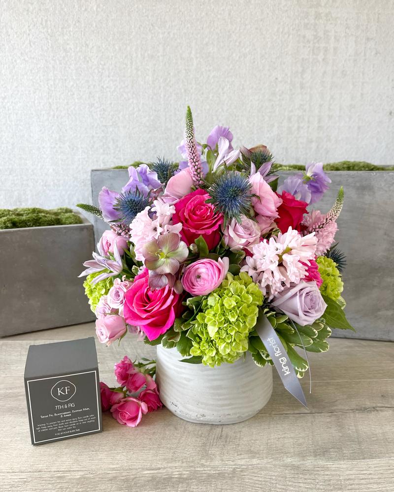 Floral Arrangement and a Candle size, inches height and inches wide.
