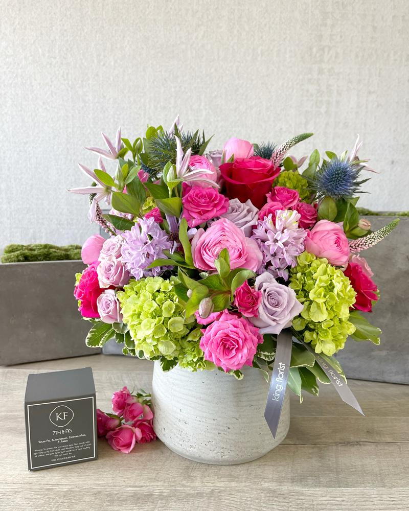 Floral Arrangement and a Candle size, inches height and inches wide.
