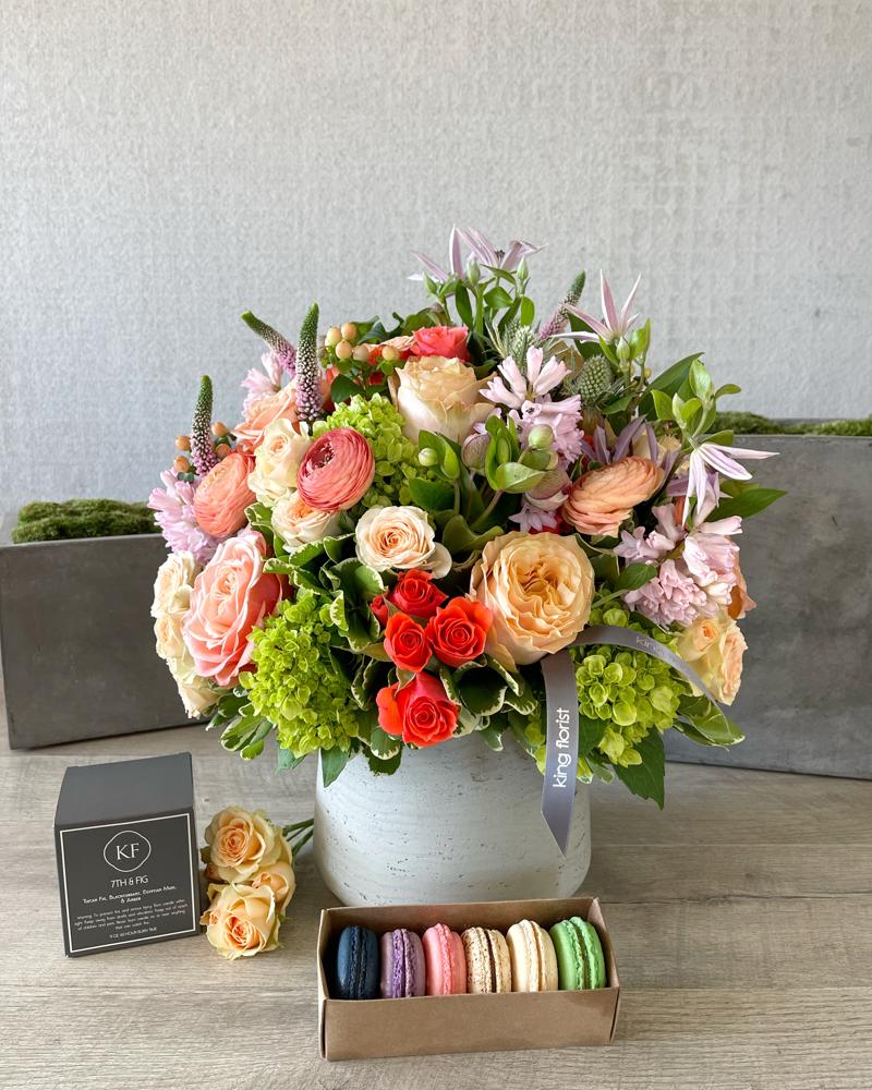 Floral Arrangement, Half dozen Macarons, and Candle size, inches height and inches wide.