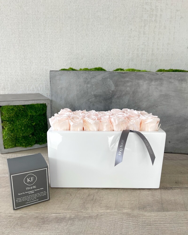 Floral Arrangement and a Candle size, inches height and inches wide.