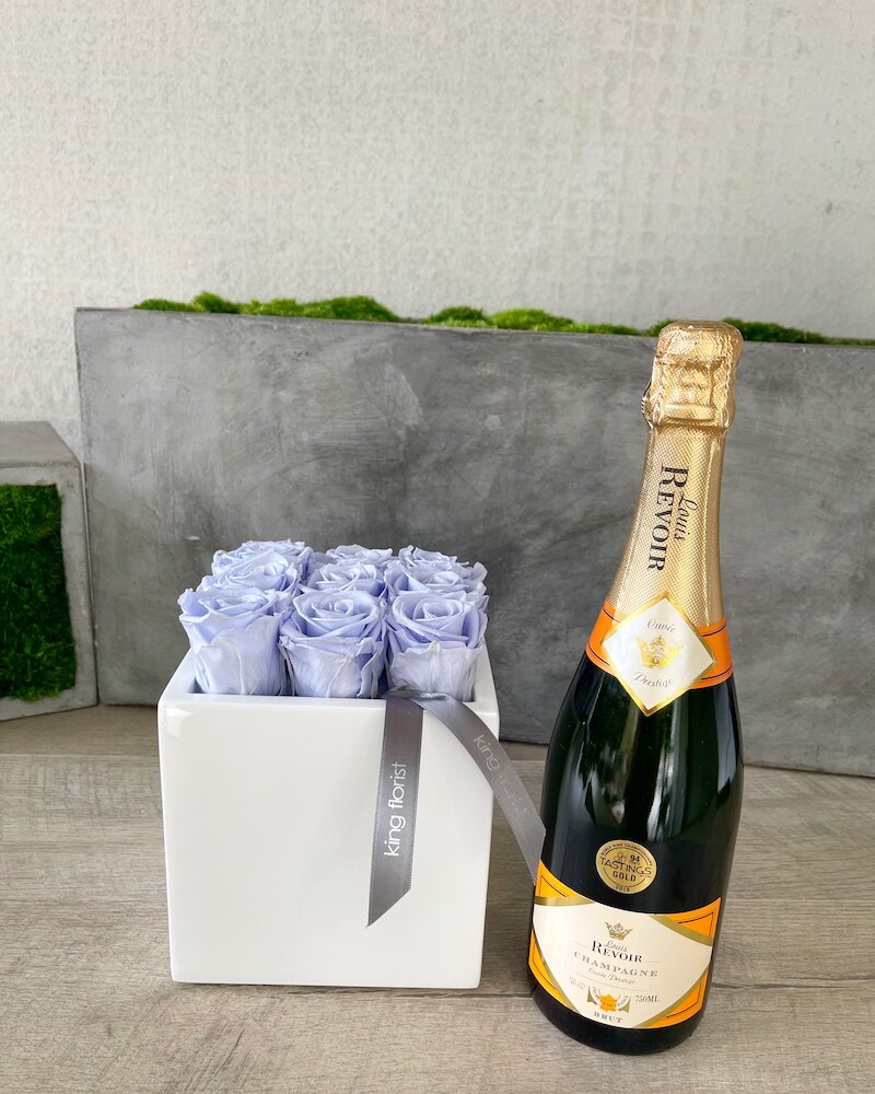 Floral Arrangement and Champagne size, inches height and inches wide.