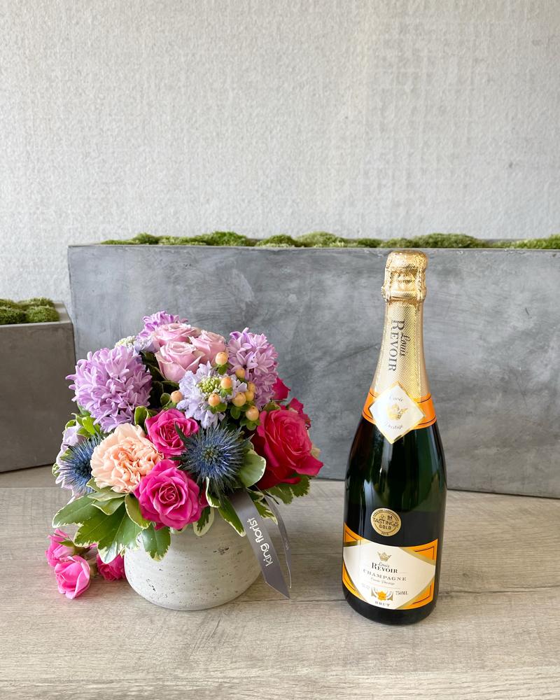 Floral Arrangement and Champagne size, inches height and inches wide.