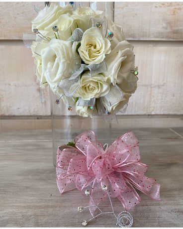 Corsage with clear rhinestones size, inches height and inches wide.