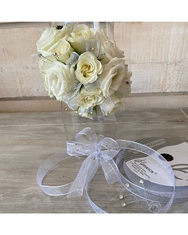 Corsage with clear rhinestones size, inches height and inches wide.