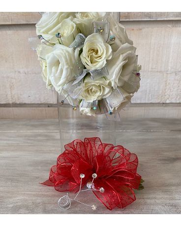 Corsage with clear rhinestones size, inches height and inches wide.