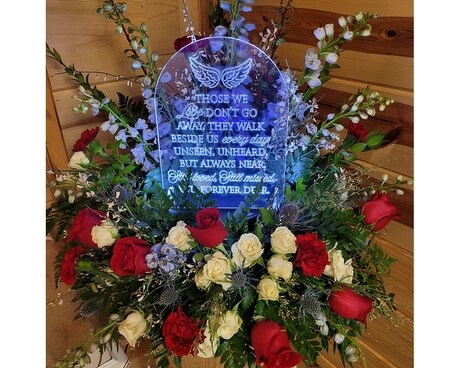 Deluxe - Surrounded by an arrangement of flowers customized to your needs. size, inches height and inches wide.