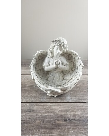 Deluxe: Features floral arrangement in statuary bowl size, inches height and inches wide.