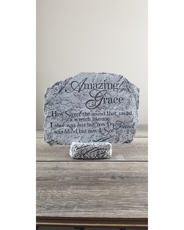 Deluxe: Surrounded by floral arrangement size, inches height and inches wide.
