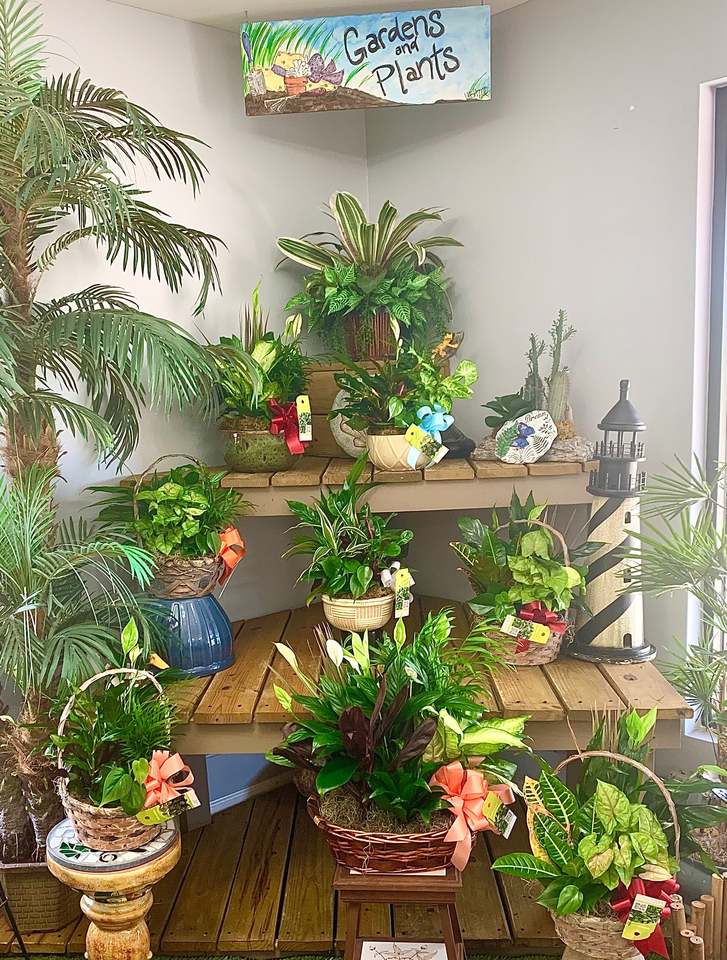 Planter of assorted greens size, inches height and inches wide.