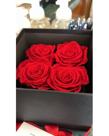 4 Red Roses In Luxury Box size, inches height and inches wide.