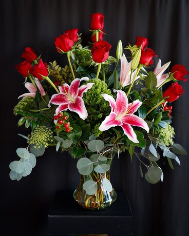 Two Dozen With Lilies size, inches height and inches wide.