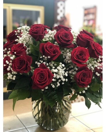 36 red roses with Baby's Breath size, inches height and inches wide.