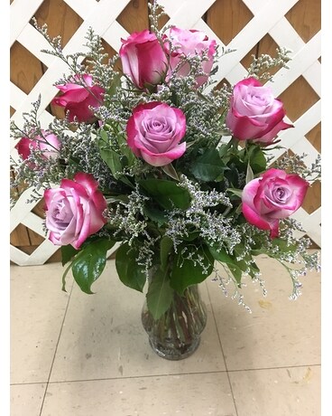 12 Raspberry roses with limonium size, inches height and inches wide.