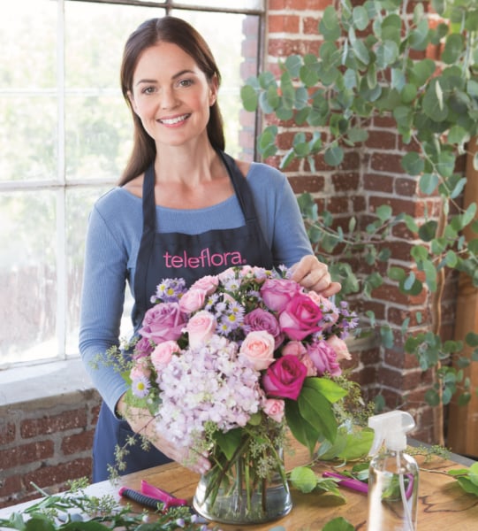 Local Florist creating a bouquet of flowers Image