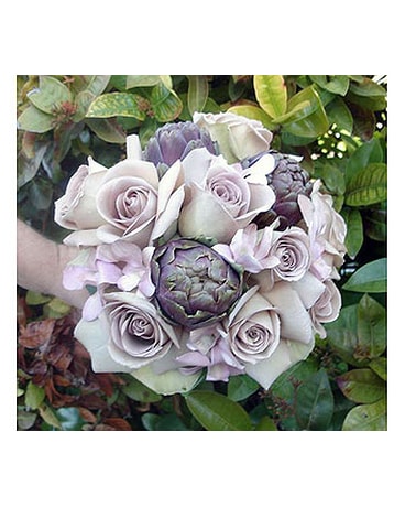 Lavender roses, orchids and artichokes bouquet