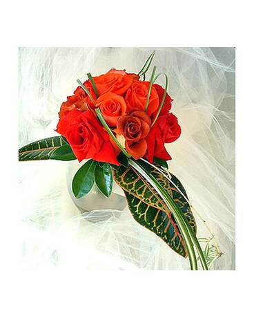Star 200) roses with tropical greenery accents