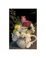 Deluxe (Teapot Will Vary) size,  inches height and  inches wide.