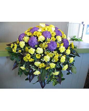custom casket spray with peacock feathers