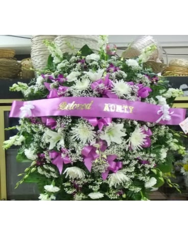 purple orchid and white flowers stand spray
